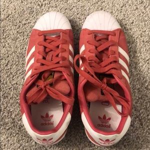 Pink suede Adidas superstars